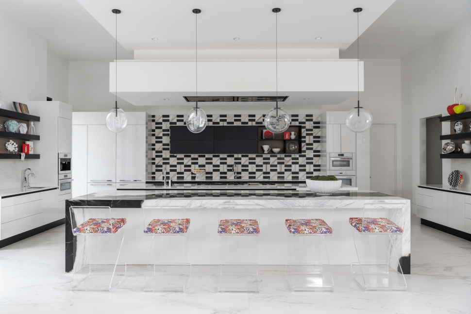 This modern kitchen is all about trendy decor, advanced fixtures and the dramatic backsplash 