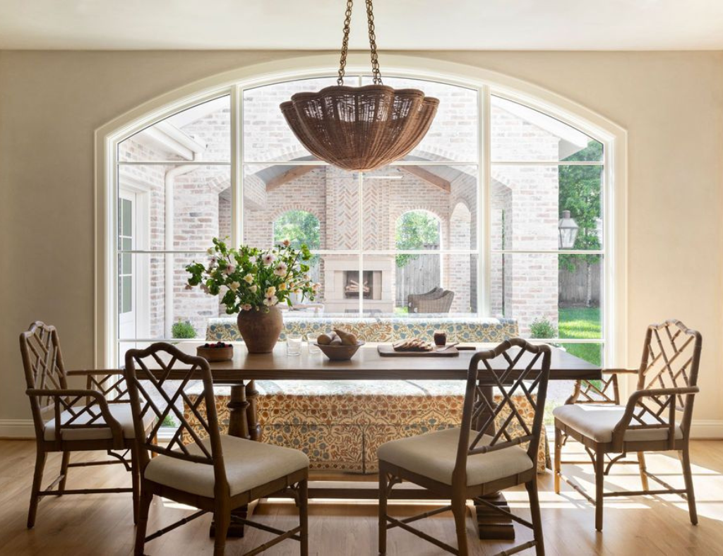 The breakfast room at Hedwig Village boasts arched windows that provide a view of the new loggia and outdoor area.