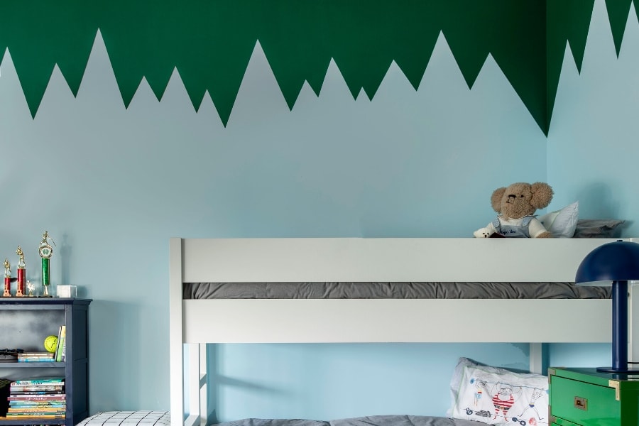 Blue and green boys bedroom singular wall design in Houston home