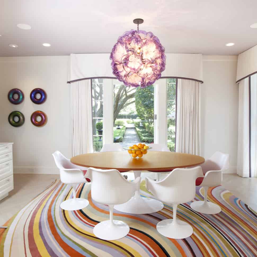 Mid cenutry modern dining room design with Tulip Chairs, Saarinen Table and colorful area rug