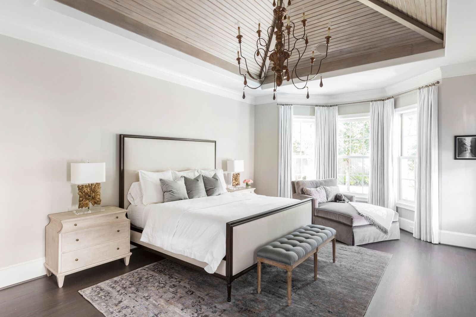 Crisp white Master bedroom, Vaulted Ceiling, Gold accents