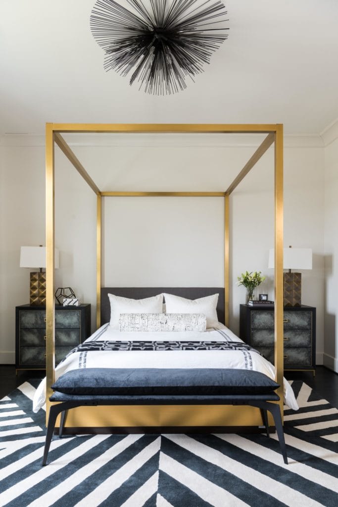 A gorgeous gold canopy bed that is both dramatic and traditional