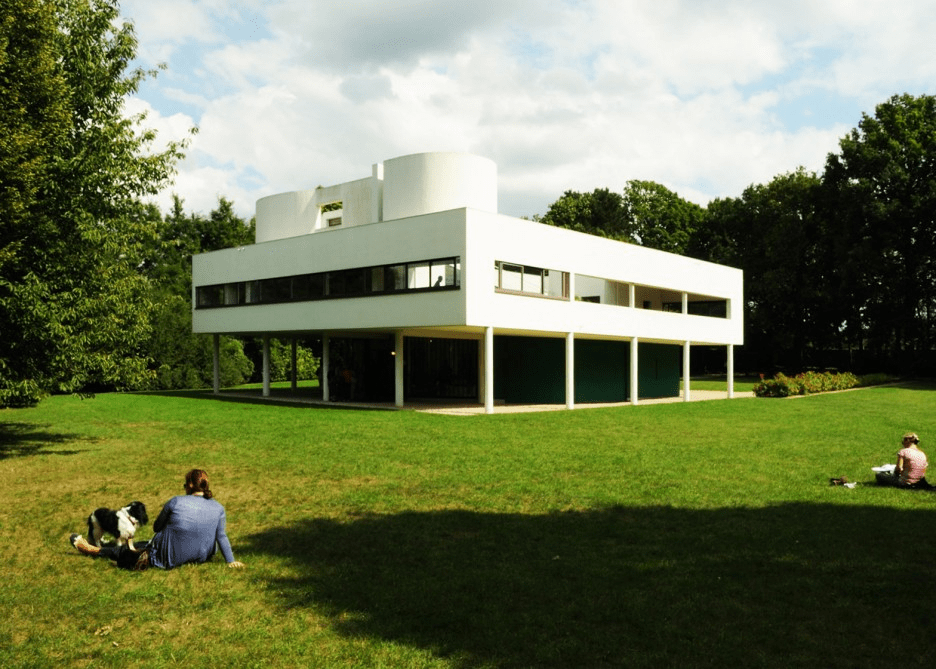 white exteriors with manicured lawn in this mid-century modern villa savoye by Le Corbusier.