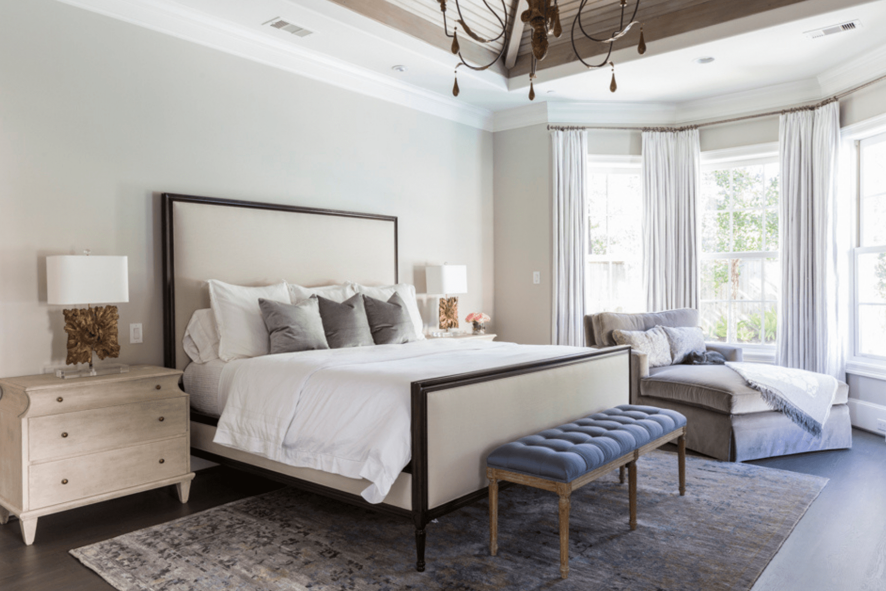 A view of the master bedroom in the Creekside Residence featuring soft palettes and textures to create a comforting space.