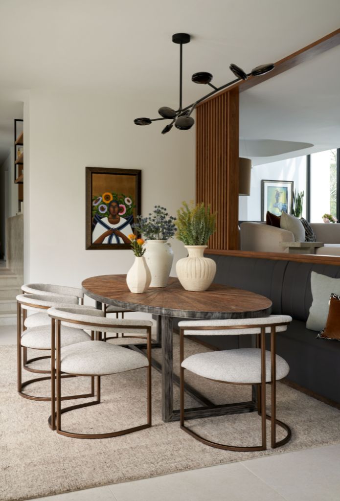 Mid-century modern dining room design by Laura U Design Collective