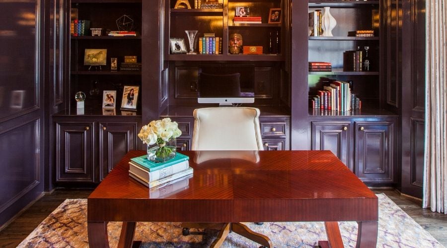 A close up of a lacquered desk in a stylish home office in Houston