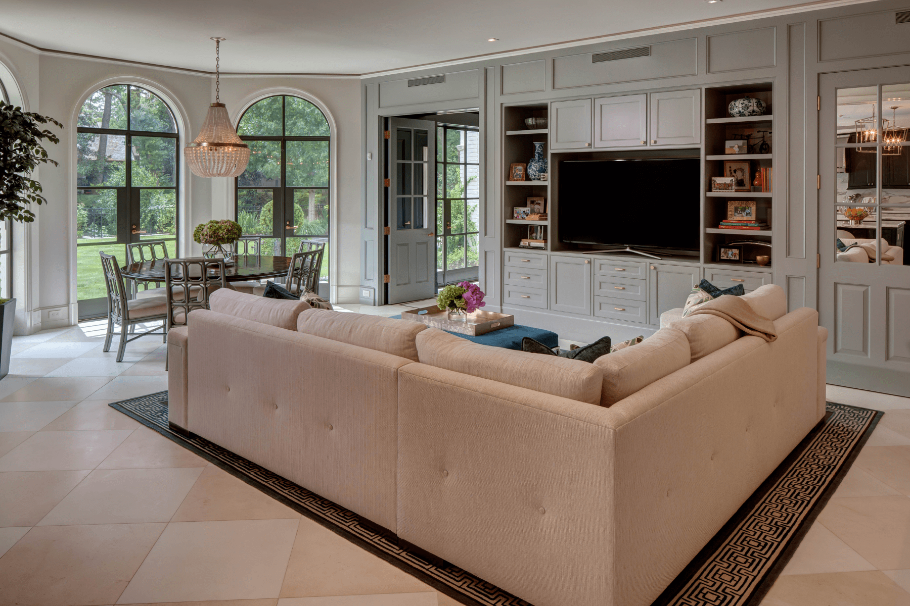 The Willowick living area features a cozy sectional in front of custom built-ins.
