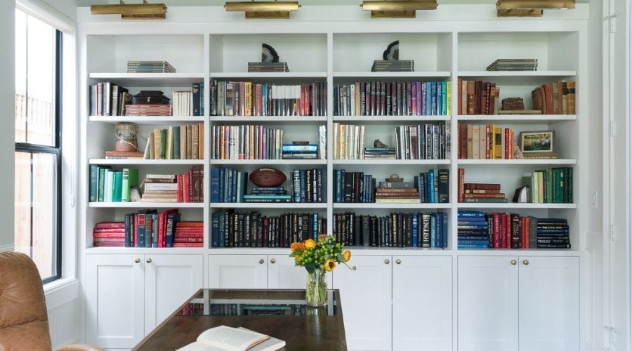 A gorgeously colorful bookshelf at the Harper office, designed by Laura U