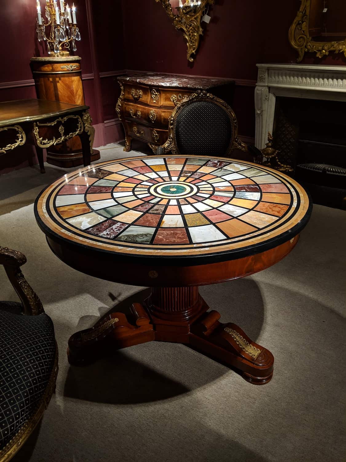 Detailed inlays make this antique table so unique!