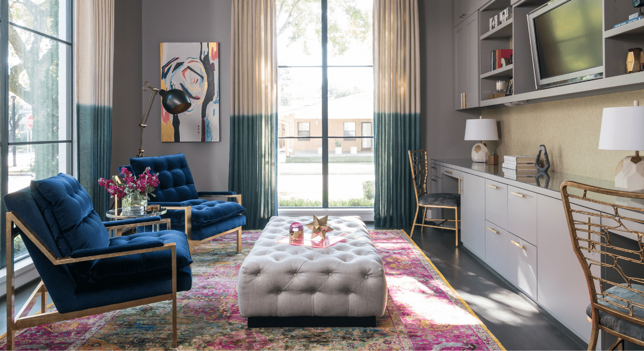 Jewel tone statement chairs in living room designed by Laura U Interior Design Collective.