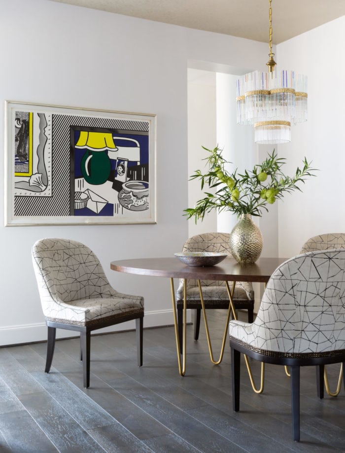 A Roy Lichtenstein hangs over a dining area in the Astoria High Rise