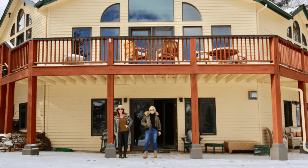 Laura Umansky and Gina Elkins Brown outside of the Mountain Lane Show House in Snowmass Village, Colorado