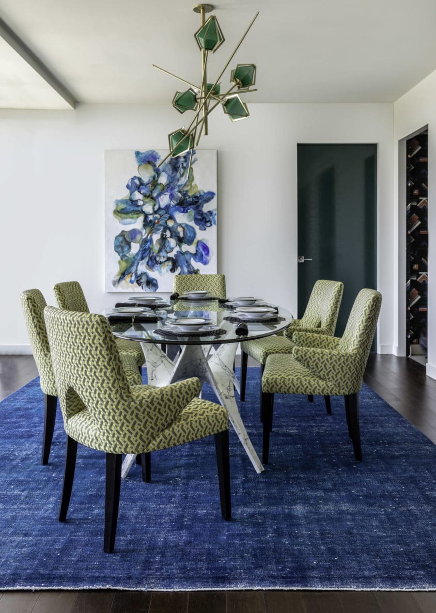 High-rise dining room with Gabriel Scott chandelier, designed by Laura U