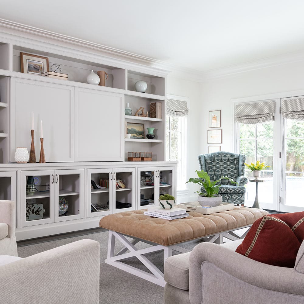 A modern family room in neutral tones, designed by Laura U