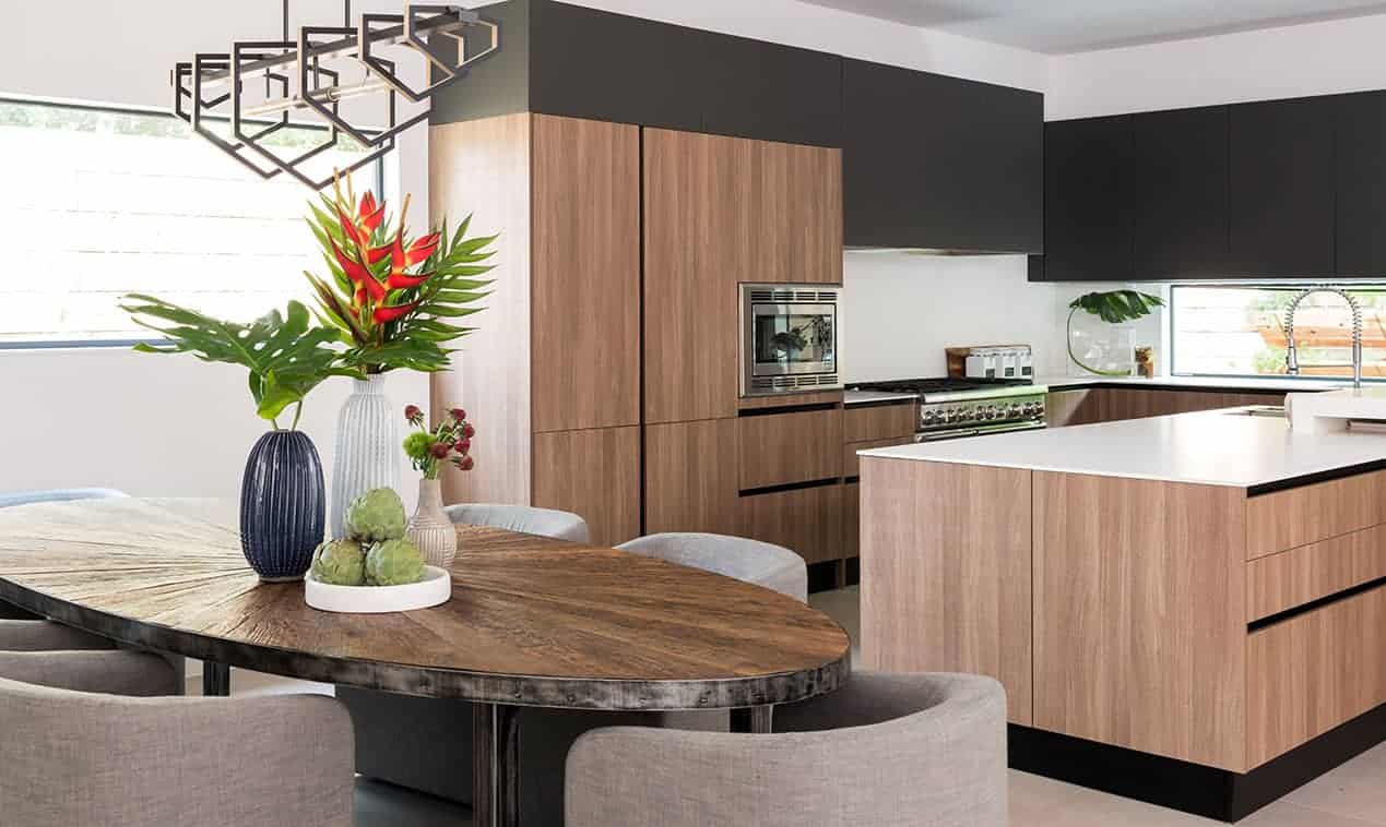 Contemporary kitchen open to the dining room, designed by Laura U Interior Design