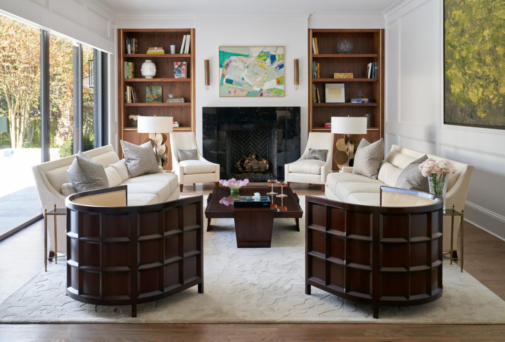 For cohesiveness, we carried over the walnut with beautiful brass inlays for the formal lounge.