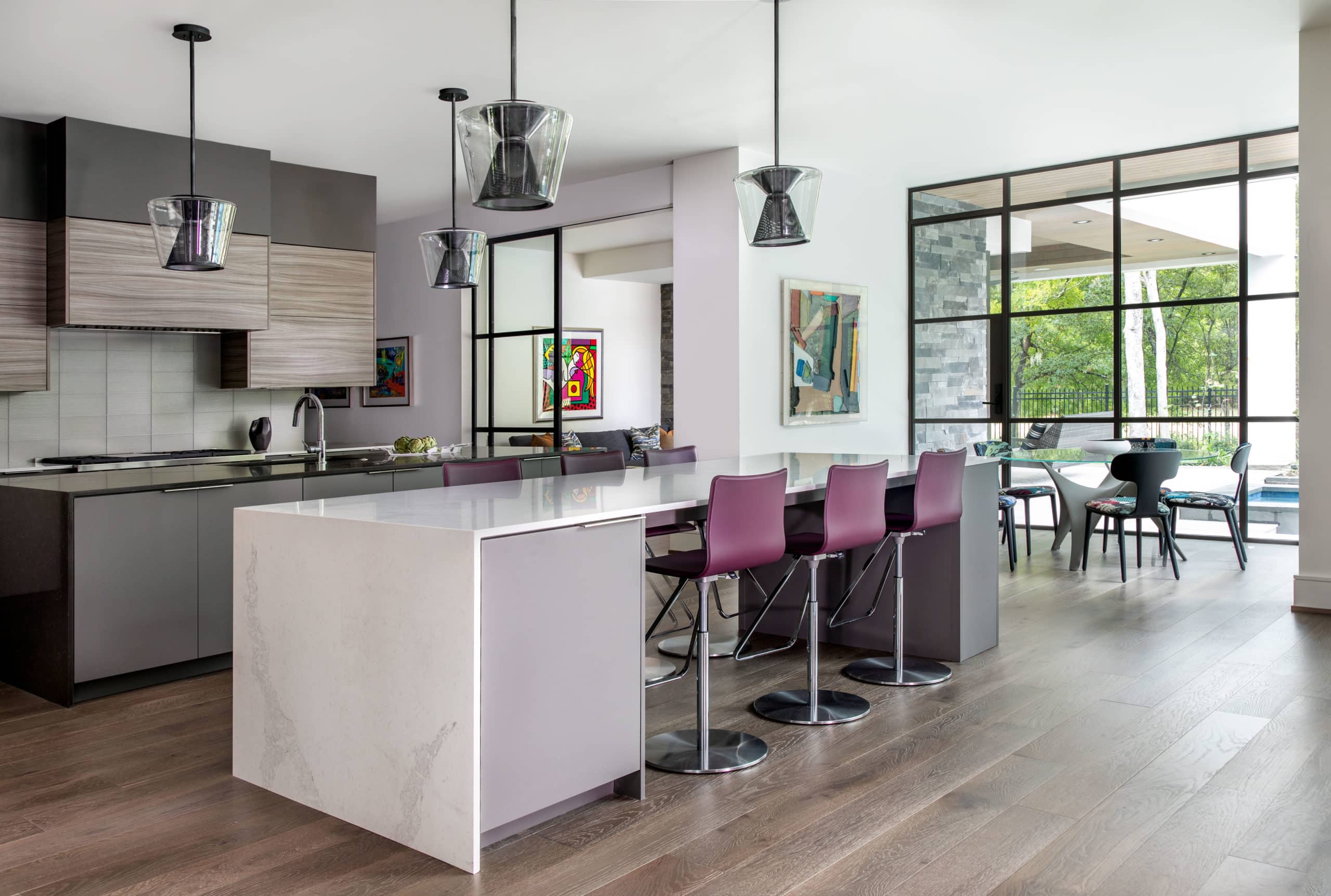The Kitchen at Regentview with aubergine stools and Troy Lighting pendants