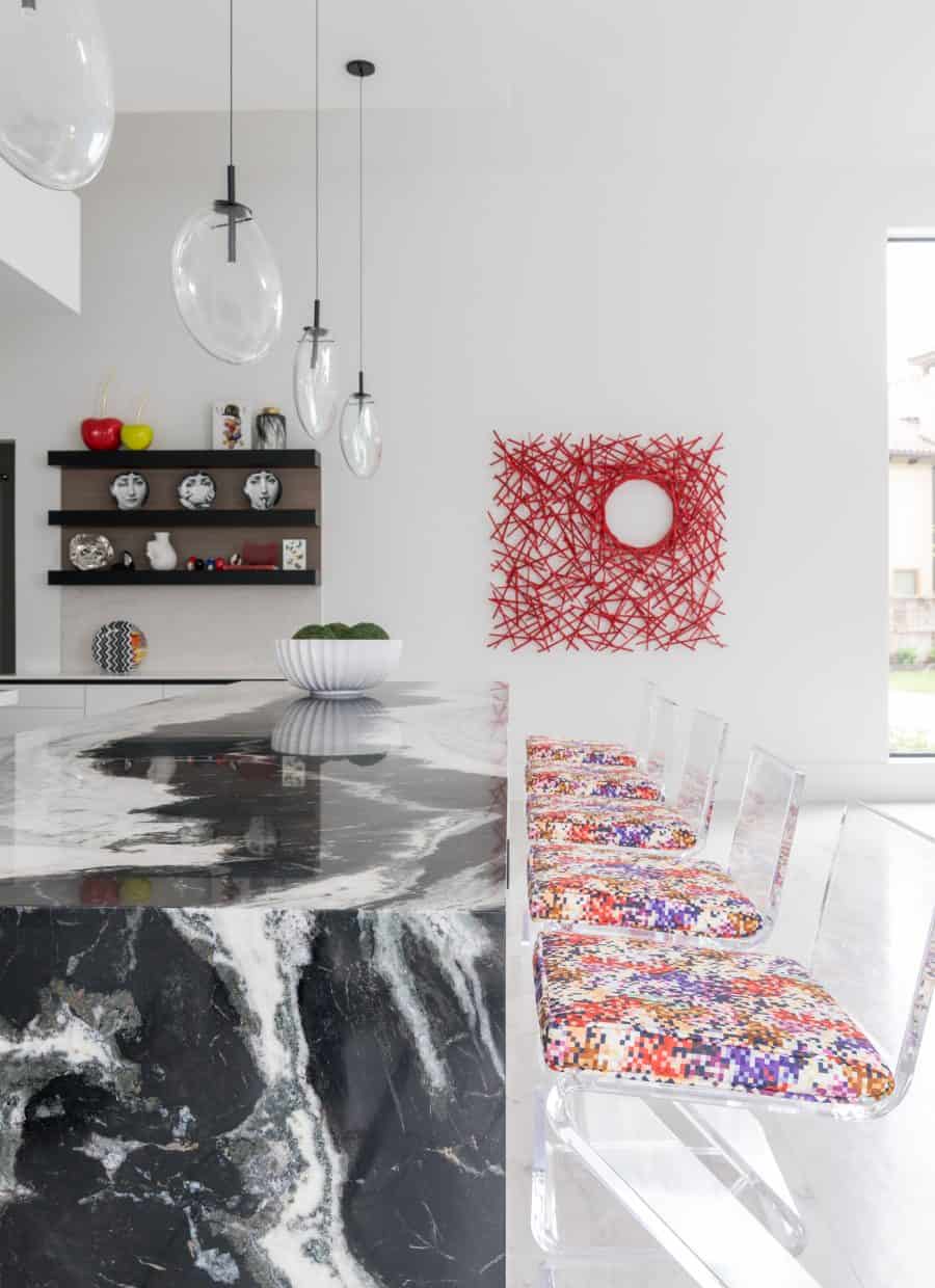 Exceptional contemporary interior design in this kitchen with acrylic chairs, by Laura U