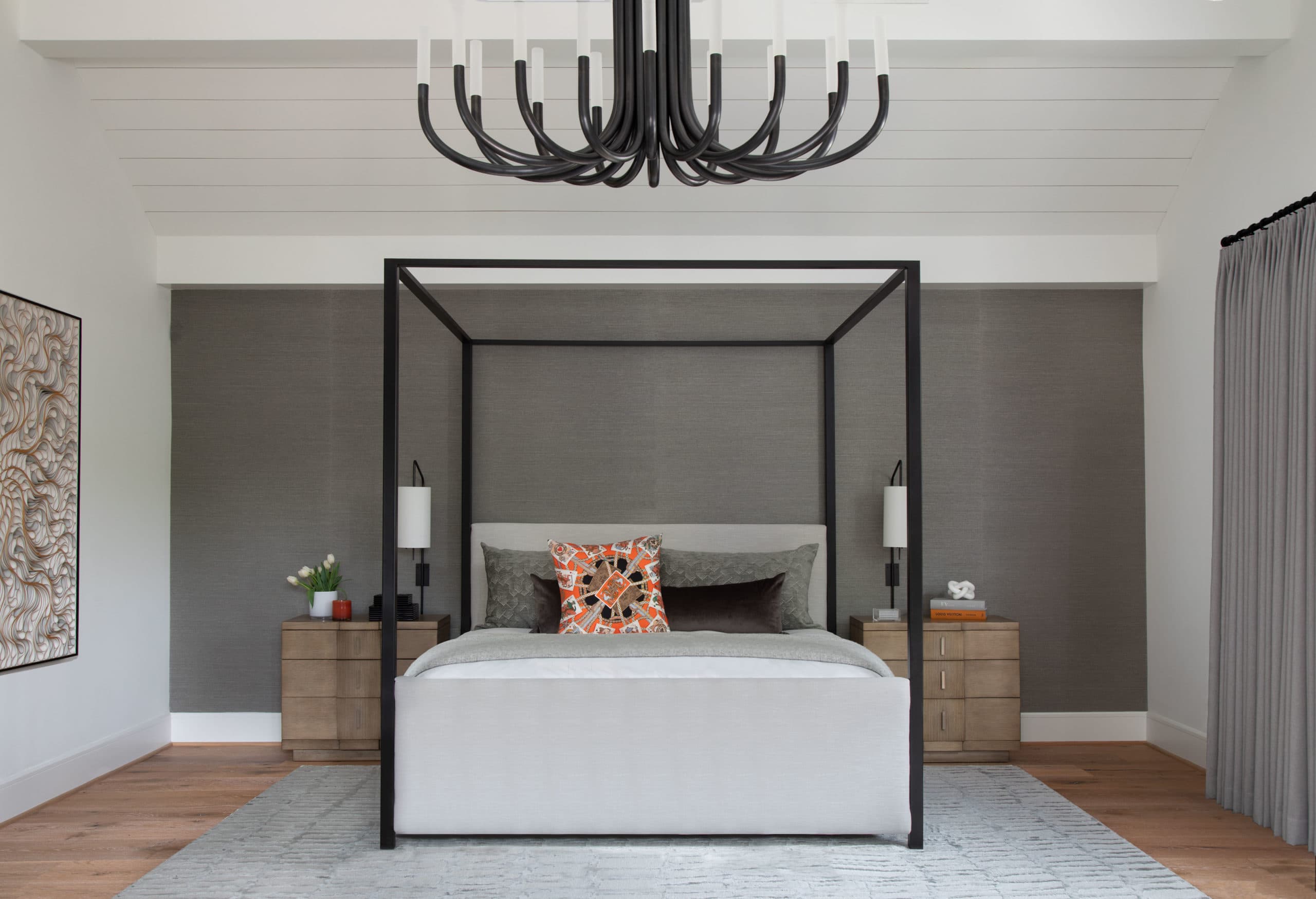 The grand master suite of a modern home in Houston, designed by Laura U