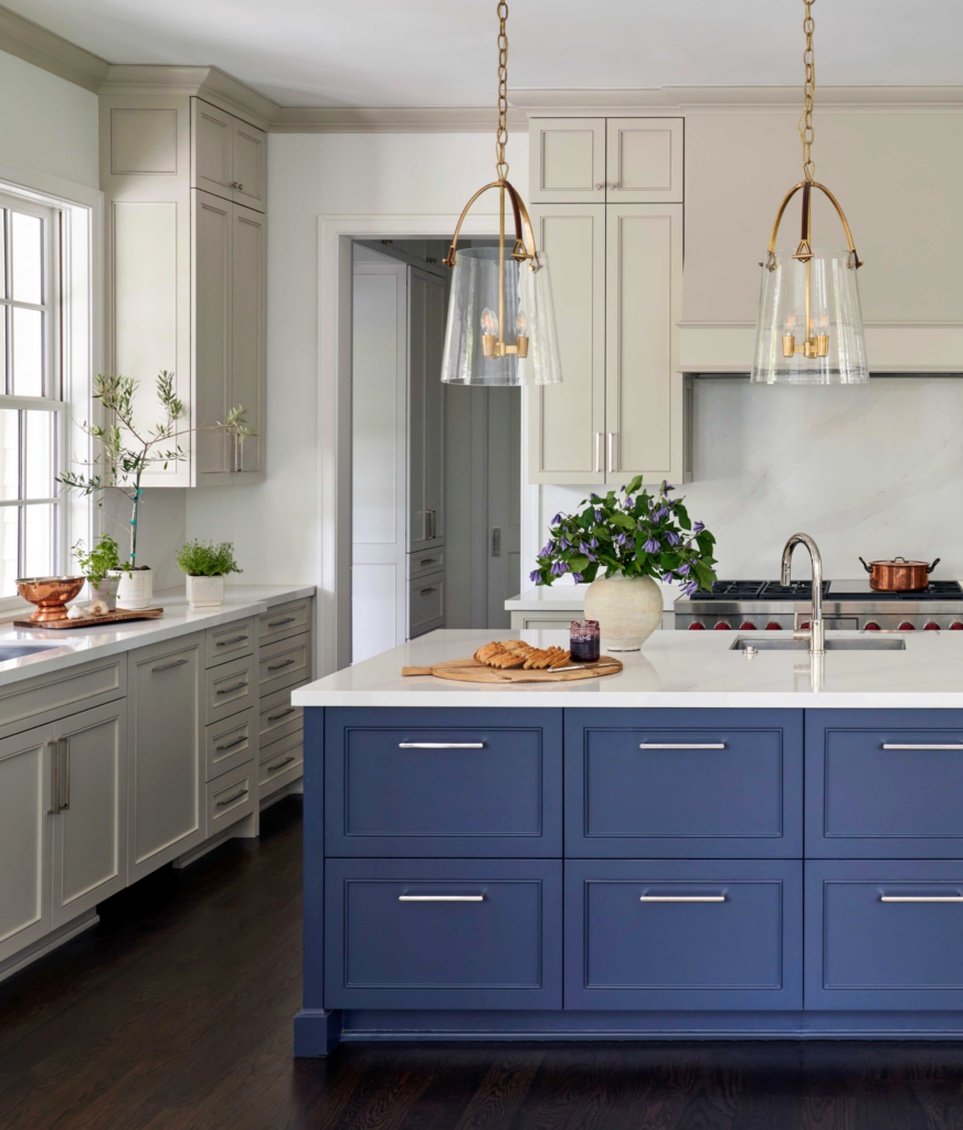 A River Oaks kitchen with cream cabinets and a French blue island.