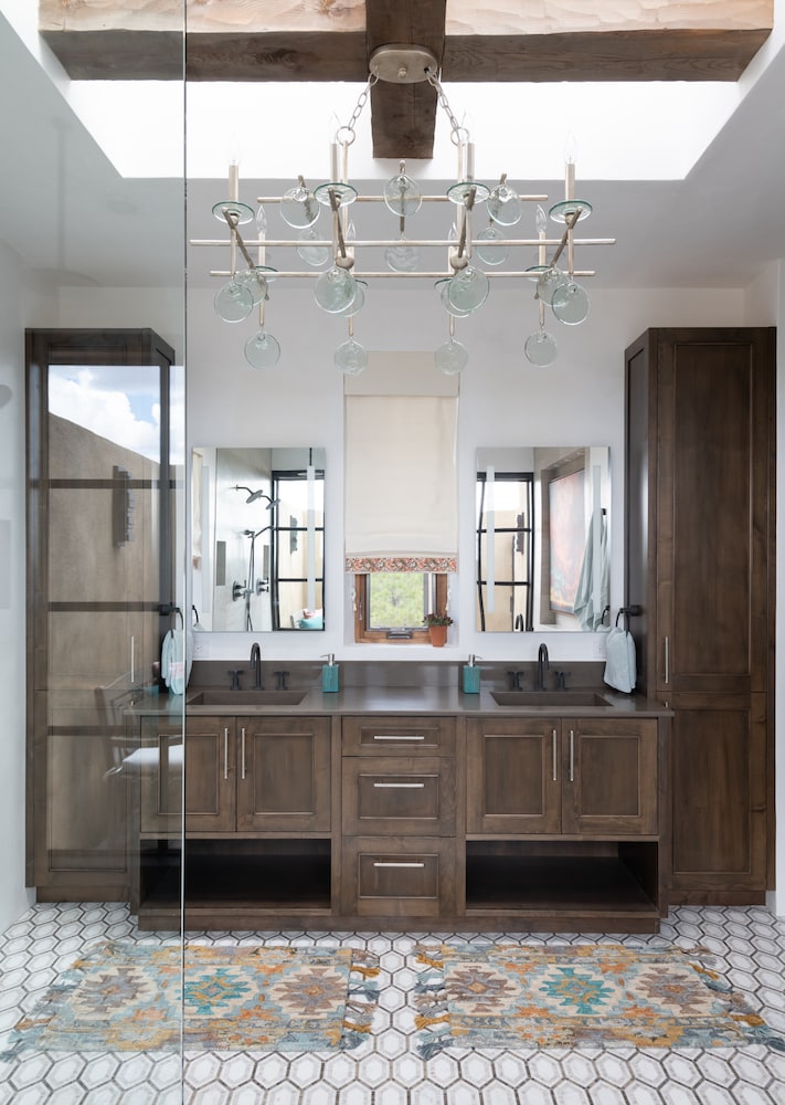 A view into relaxing light-filled master bathroom by Laura U Interior Design