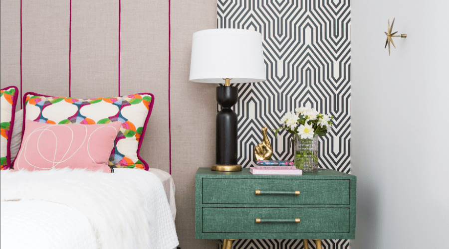 Black and white wallpaper pairs perfectly with gray furniture and bold touches.