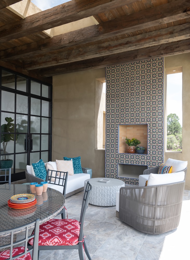 Colorful outdoor patio for southwestern inspired home design by Laura U