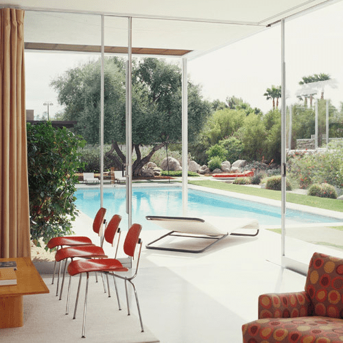 Pool with overlapping glass windows and walls in Kaufmann house by Richard Neutra