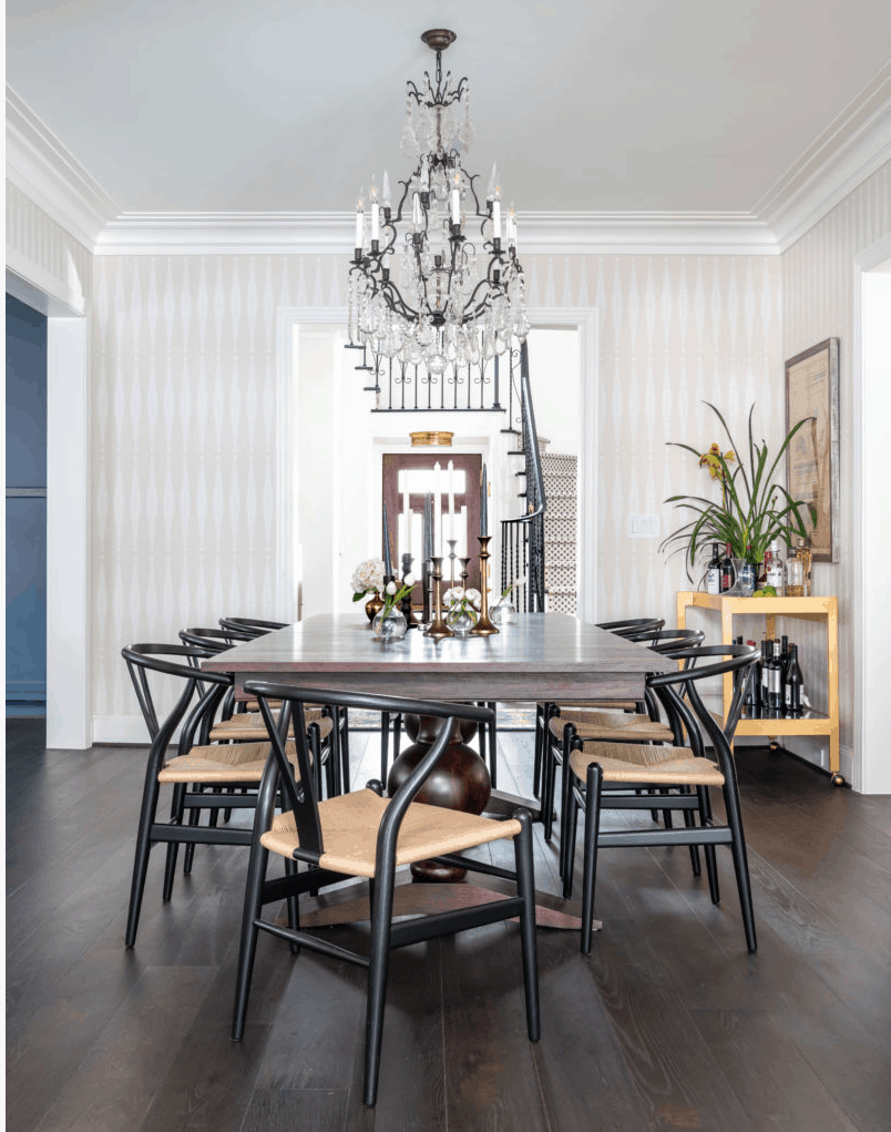 Mid century modern design dining room with wishbone chairs designed by Laura U Interior Design