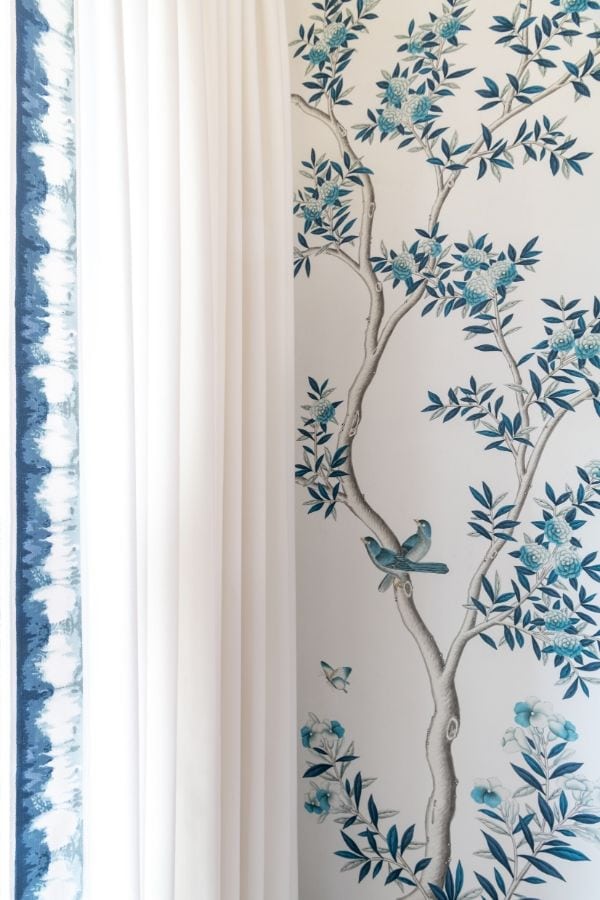 Light curtains complement hand-painted chinoiserie wallpaper by Gracie.