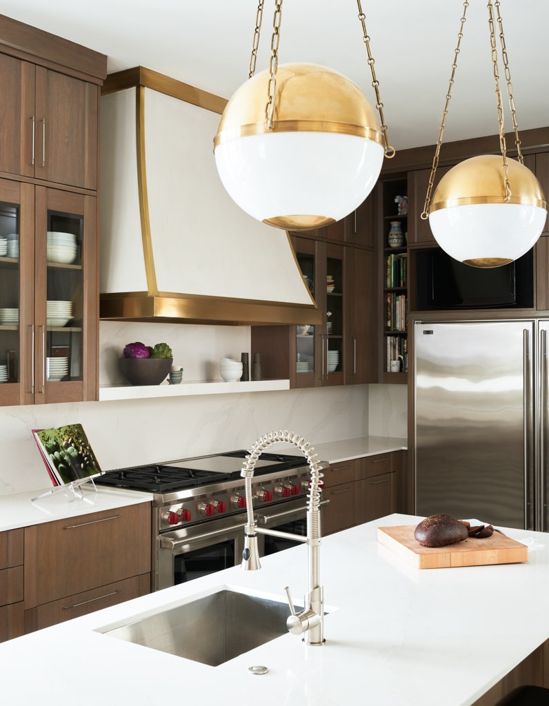 The plaster vent hood from Segreto Finishes is the focal point of the kitchen.